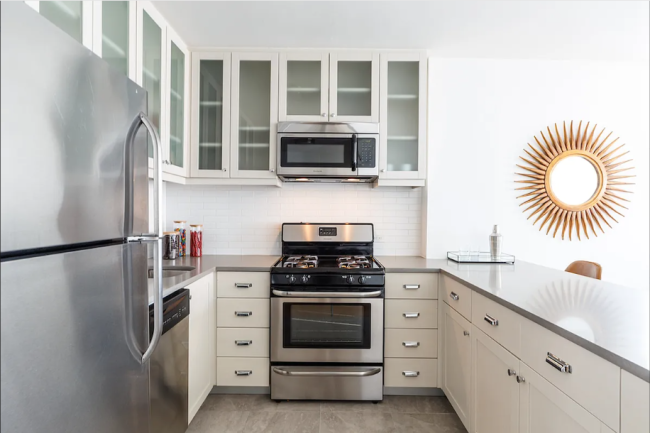 An apartment with modern stainless steel appliances