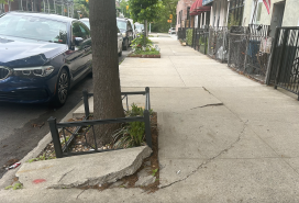 Broken sidewalk along Eighth Avenue in Brooklyn